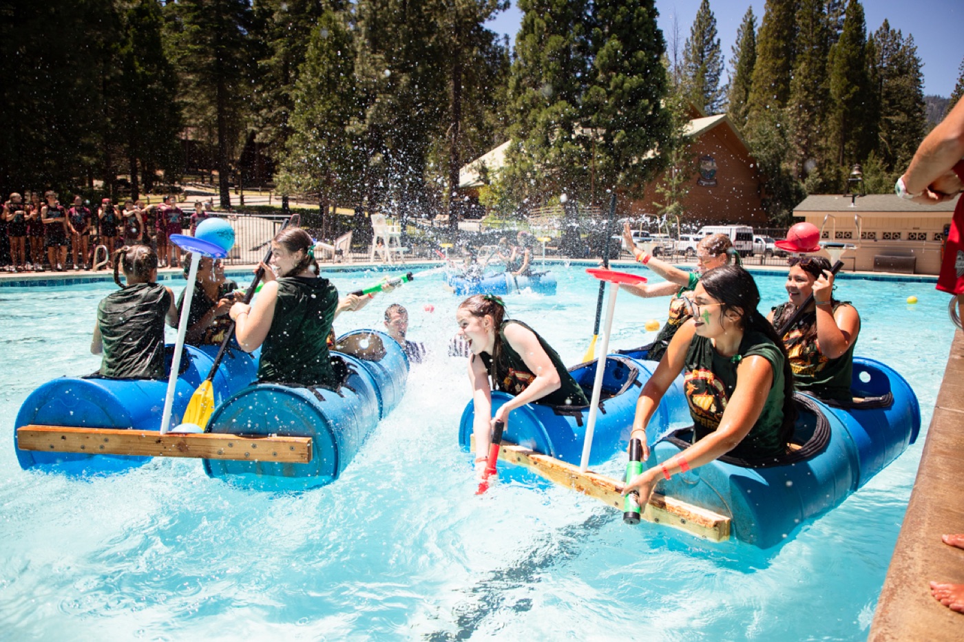 Campers on inflatable rafts in the Ponderosa pool.